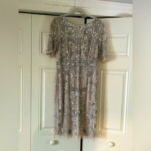 Lovely cocktail dress with beautiful sequin details.